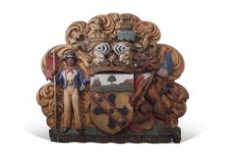 A finely carved and painted oak plaque of Lord Nelson's arms, featuring the central shield with a