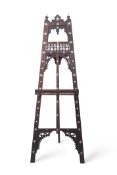 A Moorish easel with carved frieze and mother of pearl detail, 165cm high