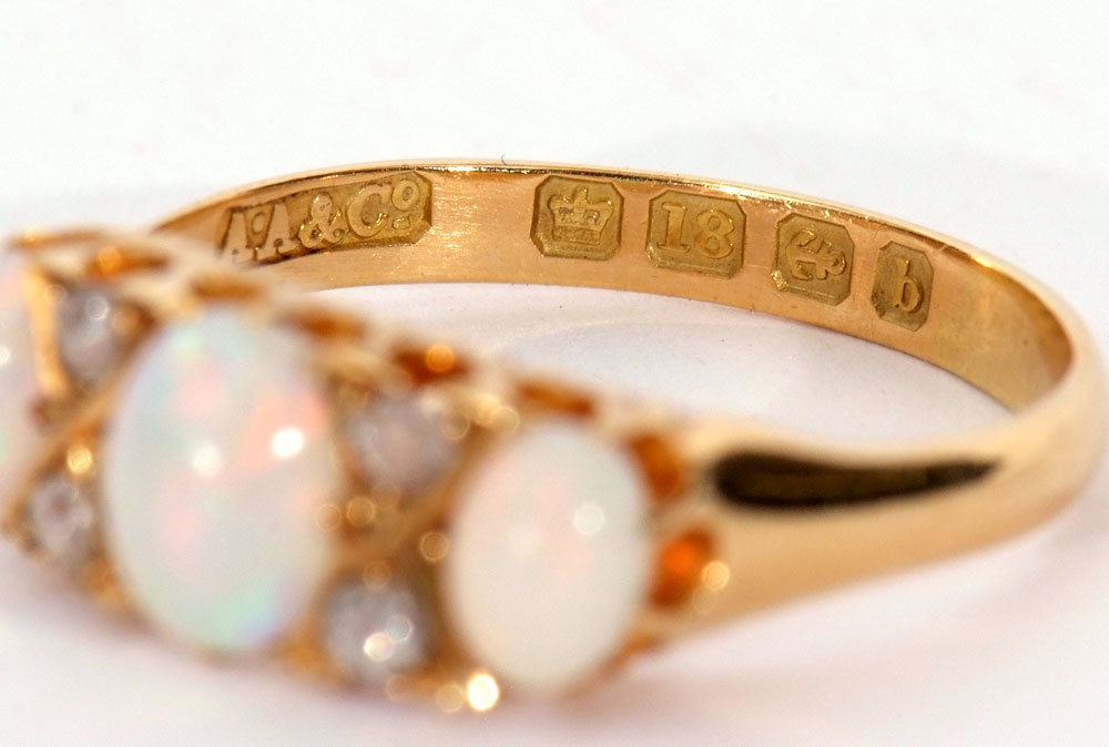 Opal and diamond ring featuring three graduated oval cut cabochon opals, highlighted with four small - Image 6 of 6