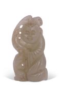 Chinese jade carving of a man with dog by his side, 6cm long