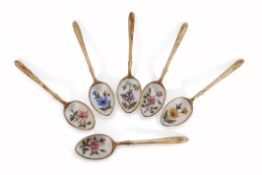 Cased set of six silver gilt and enamel tea spoons, each bowl decorated with different floral