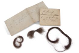 Two paper packets purporting to contain Nelson's hair, the first containing two small lengths,