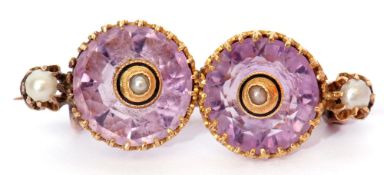 Vintage amethyst and seed pearl brooch, a design featuring two round faceted amethysts, each