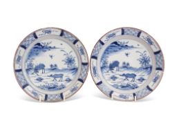 Pair of 18th century Dutch Delft plates, the centre painted in Chinese porcelain Kangxi style with