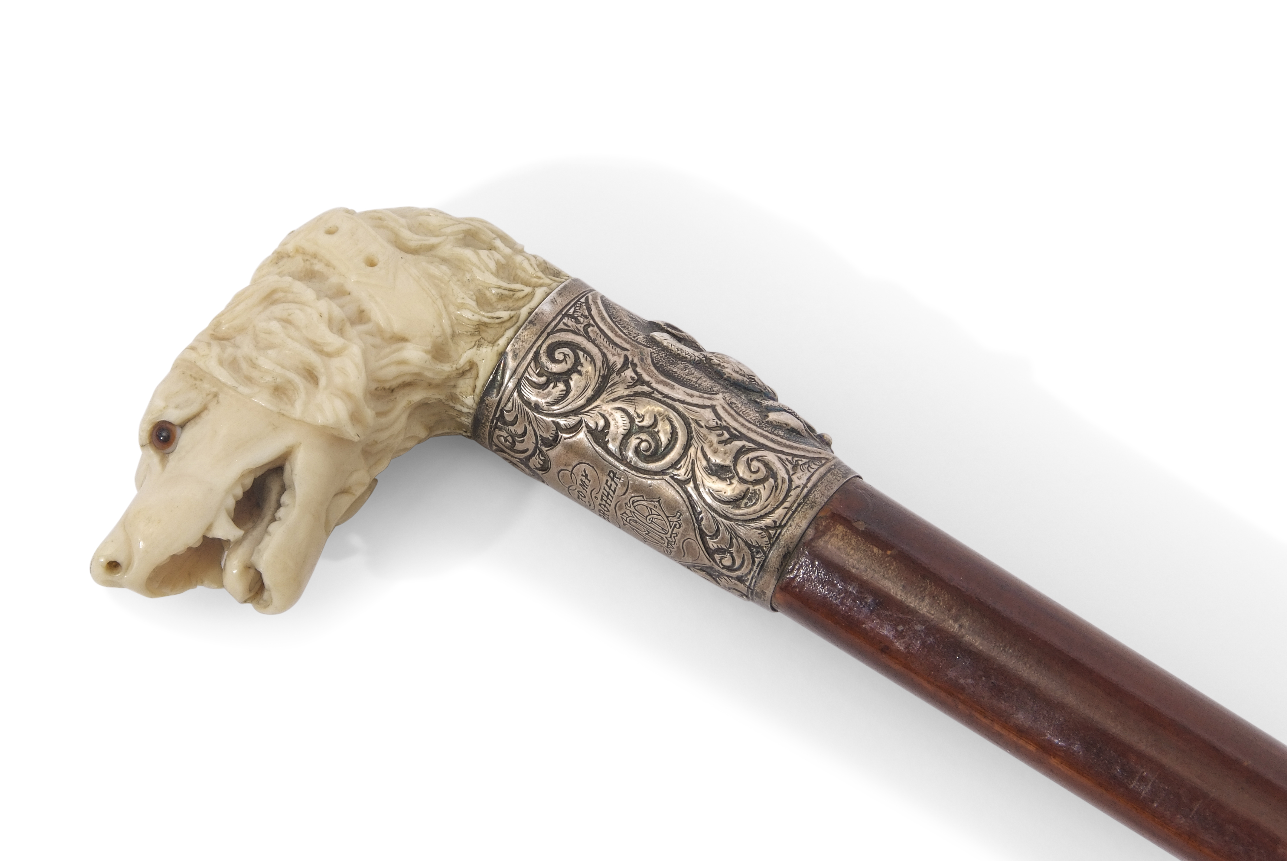 19th century hunting cane, the ivory handle carved in the form of a hound with glass or