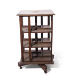 Goodall Lamb & Highway Ltd of Manchester, early 20th century revolving oak bookcase, a metal
