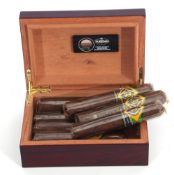 Eight C.A.O. Brazilia Pirana hand made cigars (Honduras) in a fine polished and varnished wood