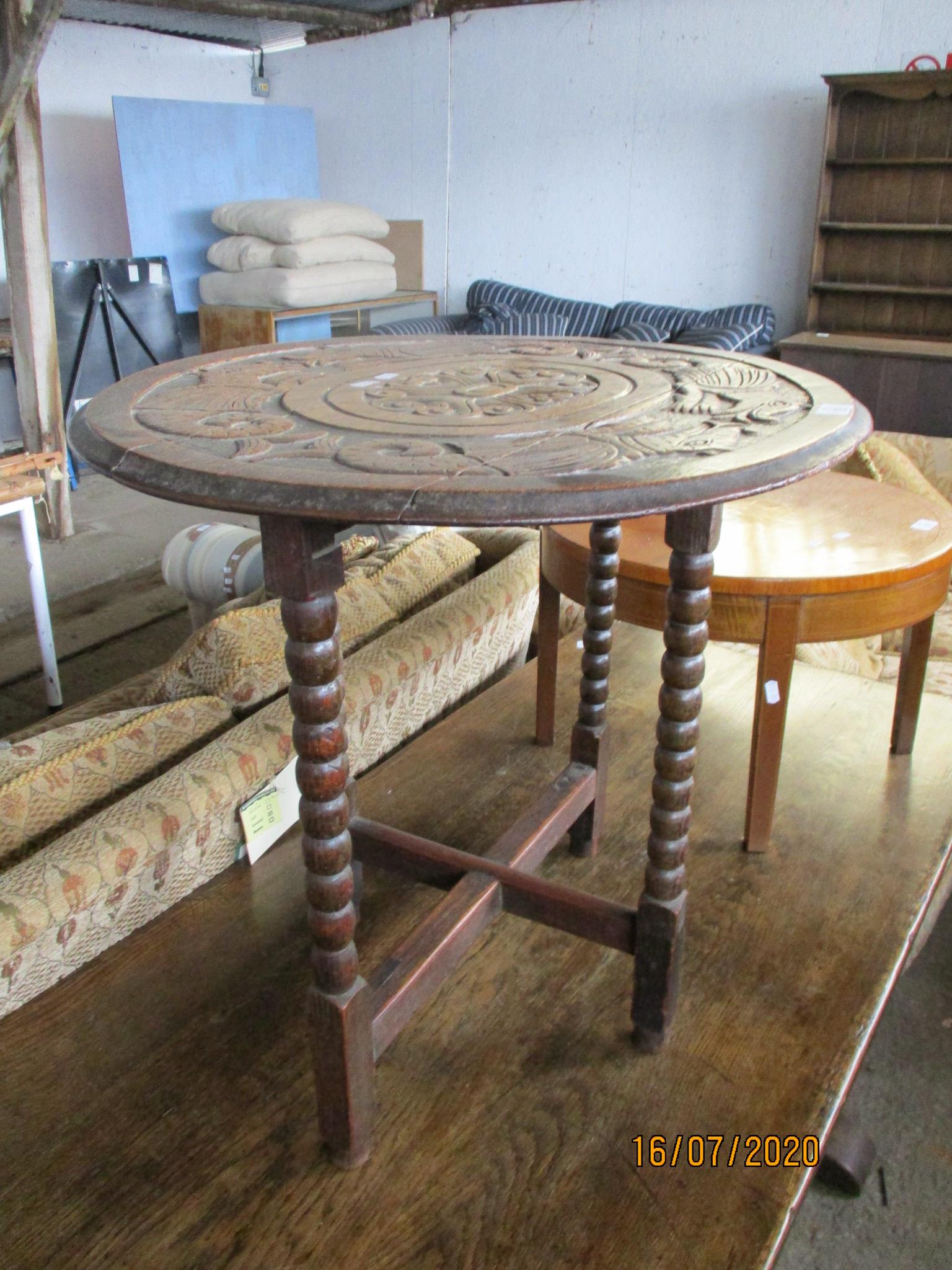 SMALL 19TH CENTURY OVAL TABLE, RAISED ON BOBBIN LEGS, HEAVILY CARVED TO TOP WITH DEPICTIONS OF