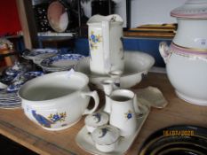 THREE PIECE WASH SET COMPRISING JUG, BOWL AND CHAMBER POT, ALL DECORATED WITH IMAGES OF A PEACOCK