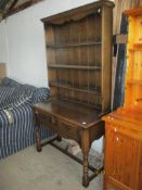 19TH CENTURY ELM DRESSER WITH TWO DRAWERS BENEATH SHELVED BACK RAISED ON TURNED LEGS, WIDTH APPROX