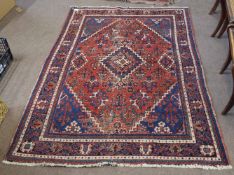 Late 20th century Caucasian wool carpet with multi-gull border, central panel of lozenge, mainly red