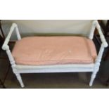 White painted duet stool or window seat, moulded arms and frieze and raised on four fluted supports,