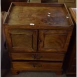 Early 19th century mahogany night cupboard with tray top over two panelled doors and two drawers