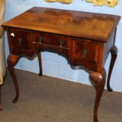 Queen Anne style walnut and walnut veneered small lowboy, the quartered veneered top with cross