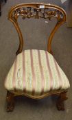 Victorian mahogany chair, arched back with carved frieze below, raised on swept uprights terminating