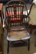 Yew and elm stick back Windsor style armchair with solid seat, splayed supports joined by a