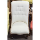 Victorian mahogany nursing chair upholstered in cream, button back