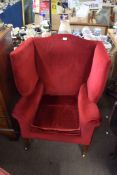 Georgian style mahogany wing back porter's type armchair, upholstered in red with tapering front