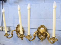 Pair of decorative gilded two-branch wall sconces, 40cm wide