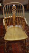 19th century yew topped stick and wheel back armchair with solid seat, ring turned splayed