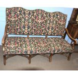 Queen Anne style oak framed triple hump back sofa with floral wool work coverings to back and seat
