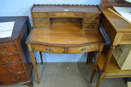 Edwardian oak and mahogany ladies desk, pediment fitted with drawers below a wavy pediment over a