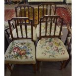 Set of four 19th century mahogany dining chairs, all with grospoint upholstered woolen seats