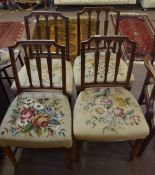 Set of four 19th century mahogany dining chairs, all with grospoint upholstered woolen seats