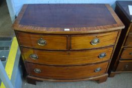 Mahogany bow fronted chest with cross banded top, over two short and two full width graduated