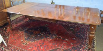Victorian mahogany extending dining table, moulded edge and raised on balustered moulded supports