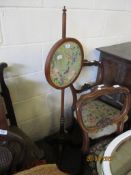 VICTORIAN MAHOGANY ADJUSTABLE POLE SCREEN HAVING A CIRCULAR SILK WORK PANEL OF EXOTIC BIRD AND