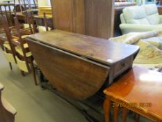 17TH/18TH CENTURY OAK GATELEG DINING TABLE OF OVAL SHAPE SUPPORTED ON BOBBIN TURNED AND BLOCK