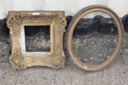 19th century ornate gilt gesso picture frame, together with a carved gesso oval frame (2)