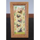 Mogul type painting of a hunting scene in white wooden mosaic type frame