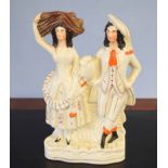 Staffordshire pottery flatback of a couple, decorated in typical fashion