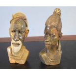 Two African carved heads of a man and a lady from the Mashona tribe, one signed R Mugari to base (
