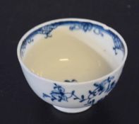 18th century Lowestoft porcelain tea bowl with blue and white floral design