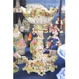 Early 20th century Continental porcelain centre piece, decorated with lady and cherubs supporting