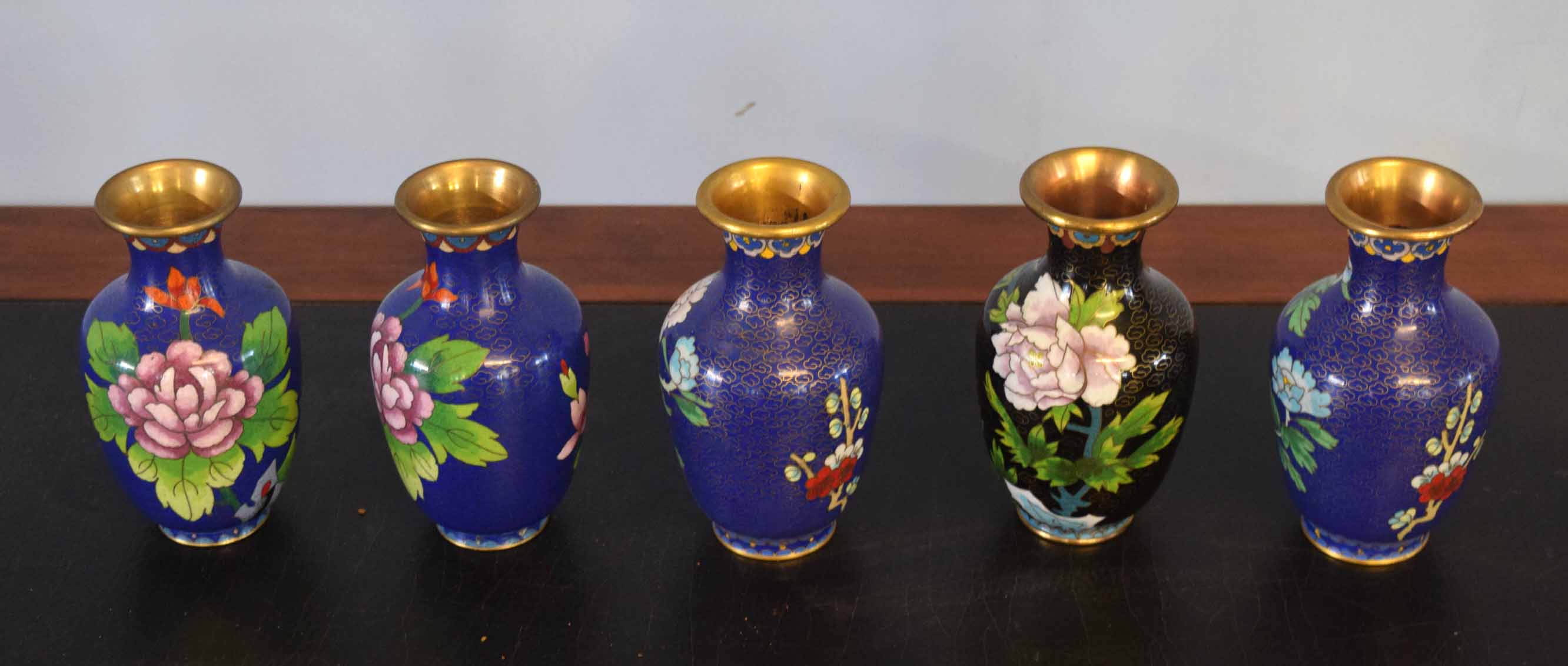 Group of five cloisonne vases, all decorated with flowers on a blue and gilt ground, 13cm high (5)