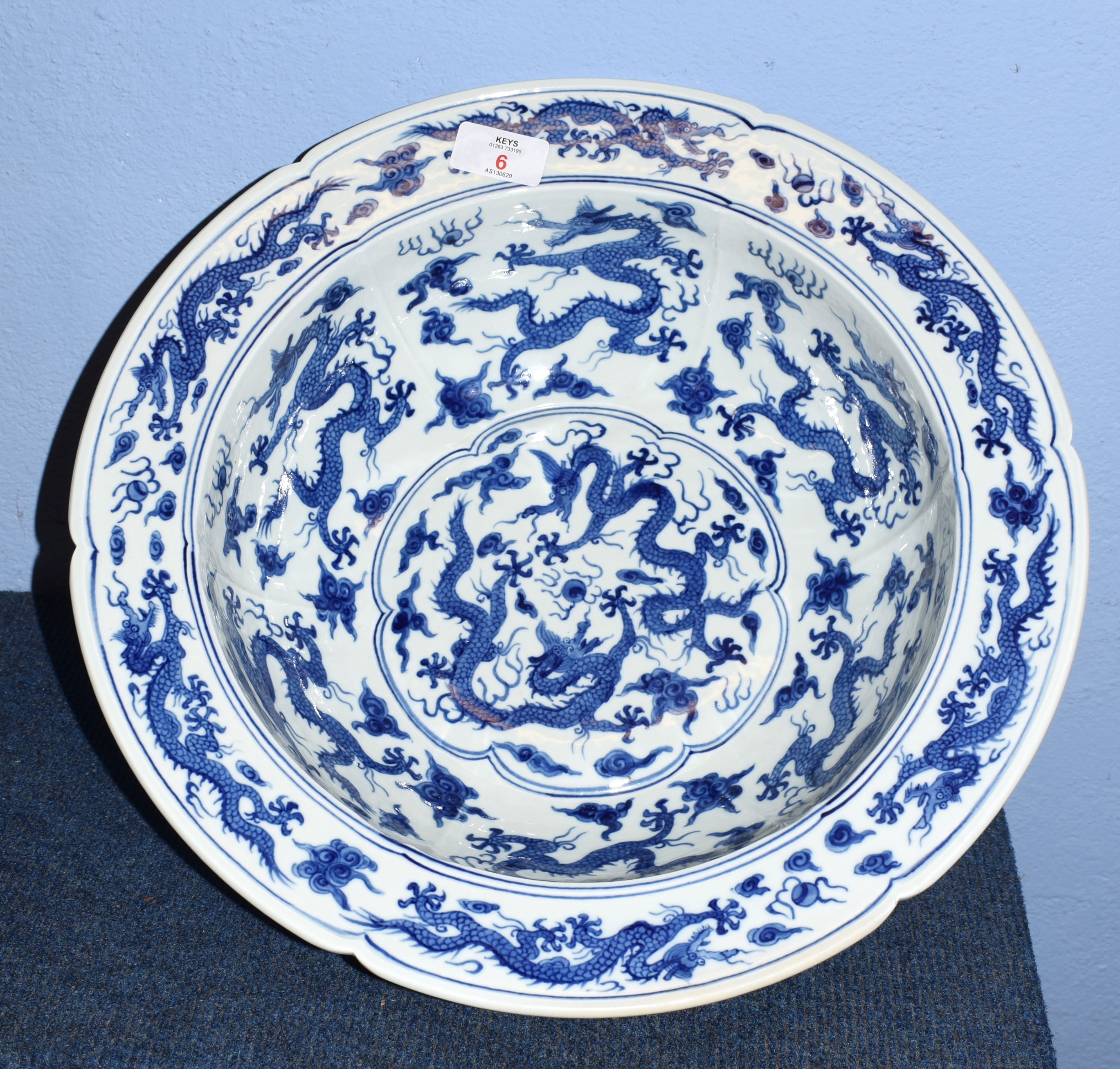 Large Chinese porcelain punch bowl of lobed shape, decorated in underglaze blue, Kangxi style with