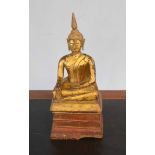 Wooden model of a Buddha, gilt painted on a wooden base