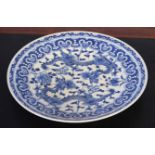 Oriental blue and white charger decorated with dragons