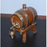 Vintage oak and silver plated mounted presentation spirit barrel, with tap and bucket on integral