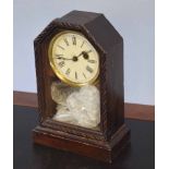 Small oak cased mantel clock with circular Roman chapter ring