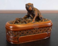Oriental seal in carved box with monkey finial