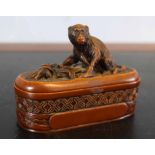 Oriental seal in carved box with monkey finial