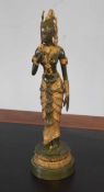 Oriental metal figure of a dancer on green base