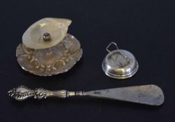 Silver handled button hook, silver and nacre shell ash tray and a further hallmarked silver stand