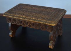 Small carved oak footstool, 40cm wide