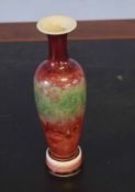 Oriental Sang de Beouf or peach bloom vase and detachable base, the vase with six character mark